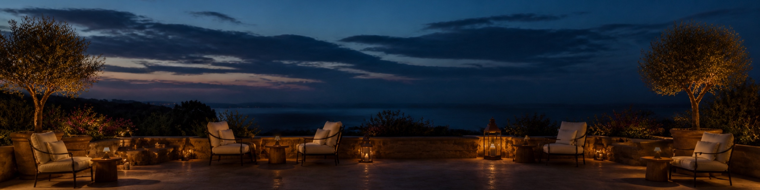 Hotel terrace at dusk with warm glowing ambient lighting